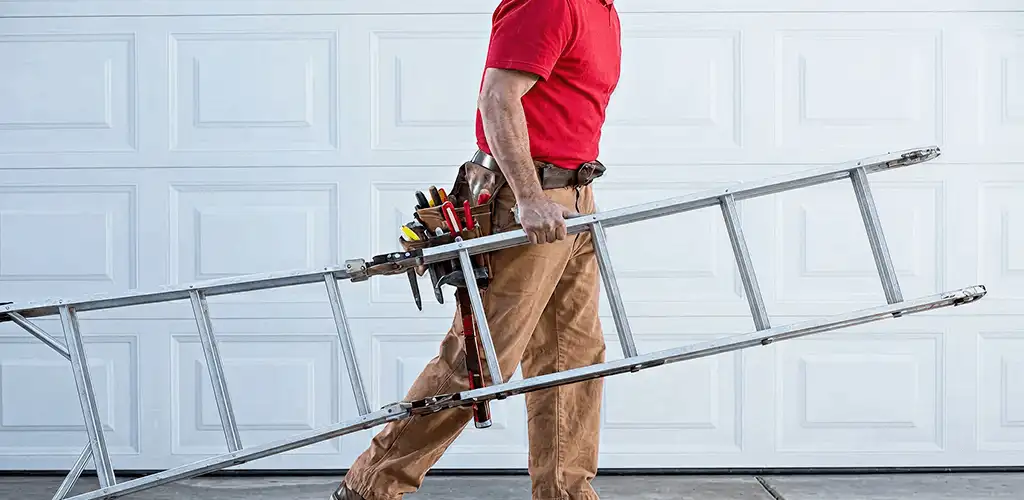 Garage door repair technician arriving with tools and ladder in St Paul, MN