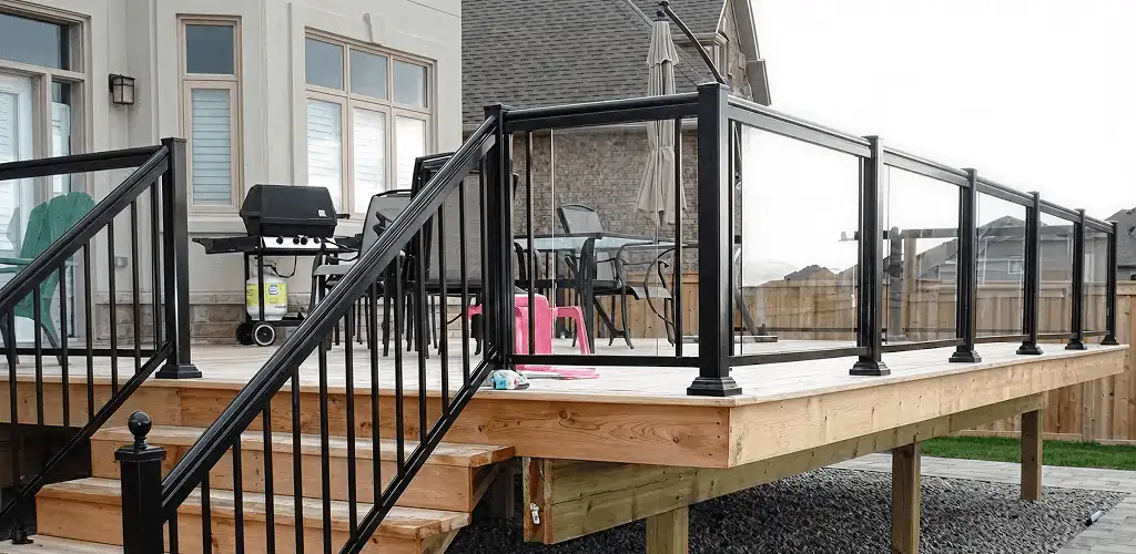 Handrail installation on a deck staircase for safety and code compliance in St Paul, MN